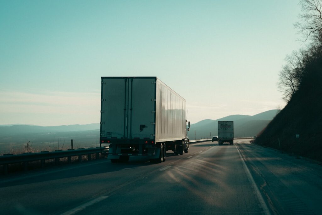 Semi trucks driving on highway - DOT compliance fleet management